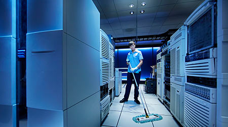 Server aisles in a data center cleaned to controlled-environment standards
